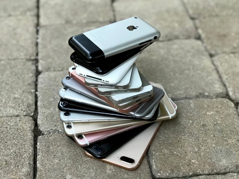 Stack of certified pre-owned iPhones representing the growing refurbished market